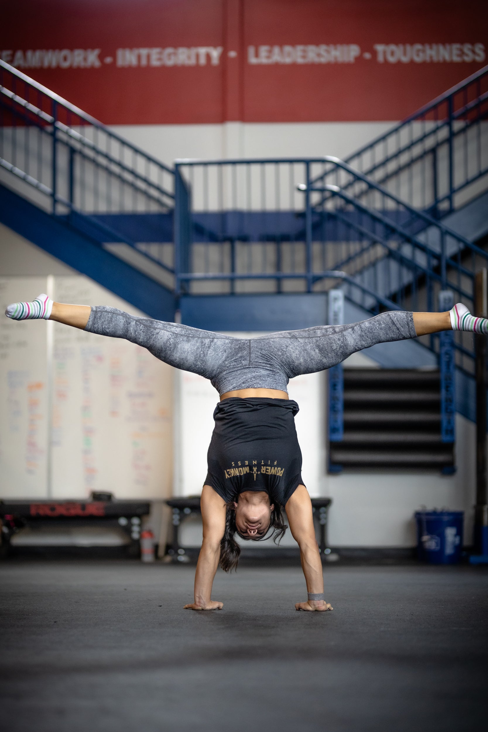 girl performing a press to handstand from the power monkey training press to handstand program