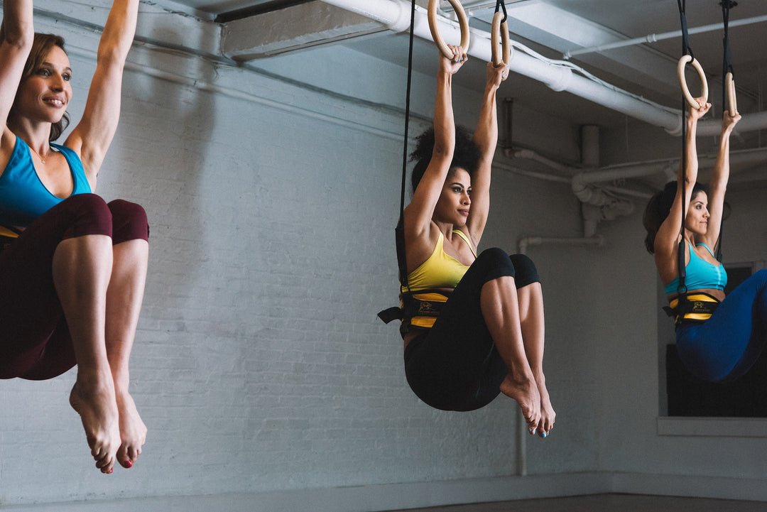 Woman using the Power Monkey Ring Thing in the Power Monkey Training app