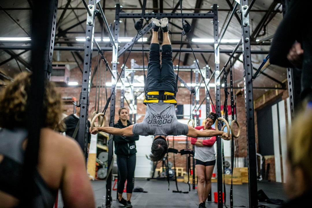 dave durante doing an iron cross using the Power Monkey Ring Thing as part of the Power Monkey Training app